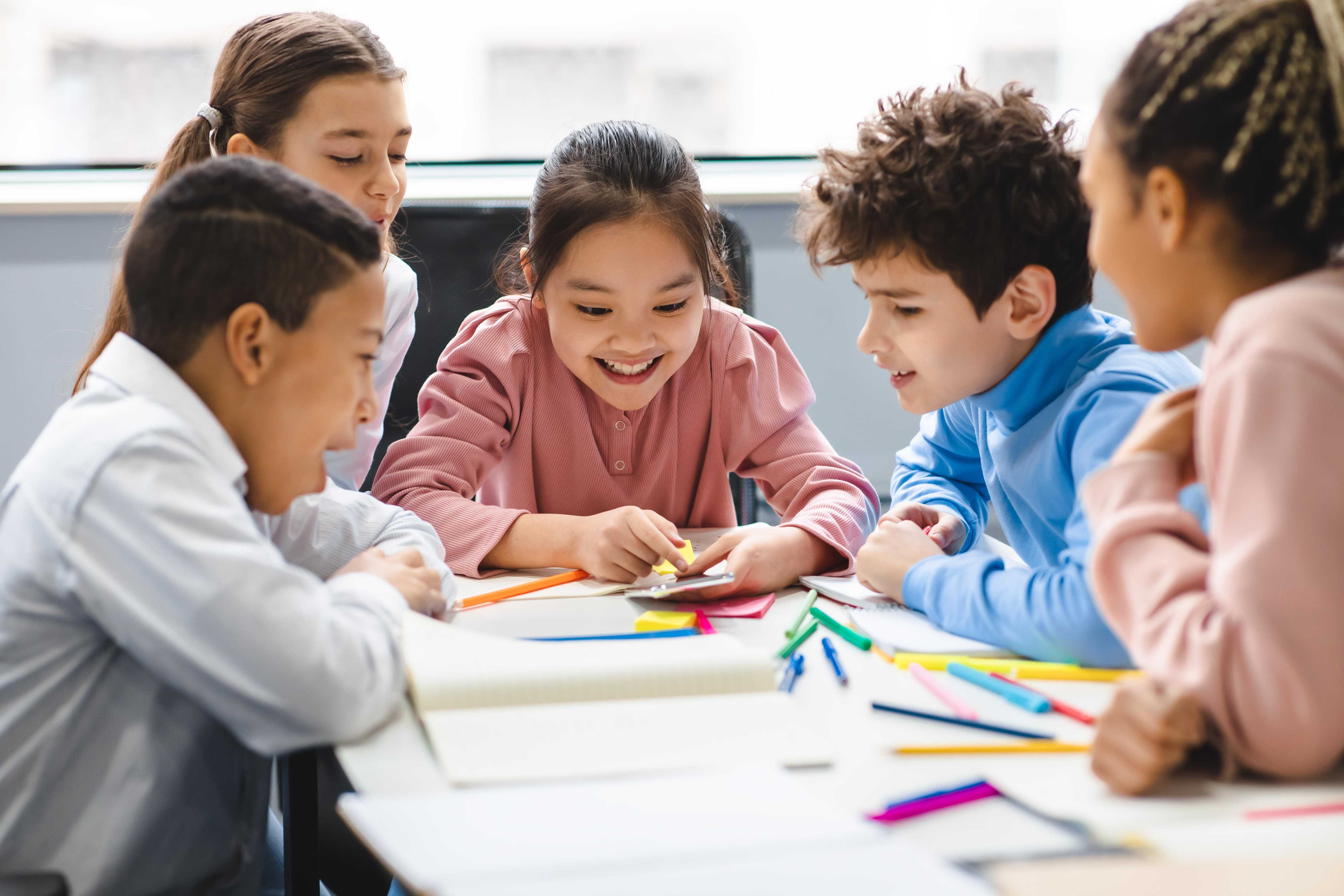 group of kid students planning on school activities