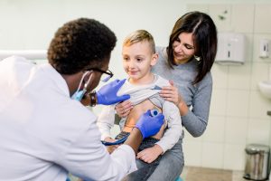 portrait-of-a-little-boy-being-checked-by-a-doctor-2024-12-13-11-13-59-utc-min